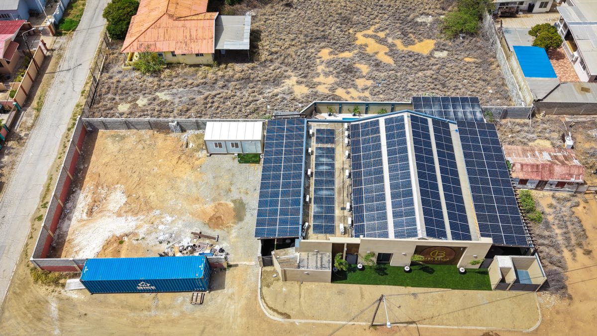 The roof of Casabella Suites from directly above, covered end to end in photovoltaic panels.