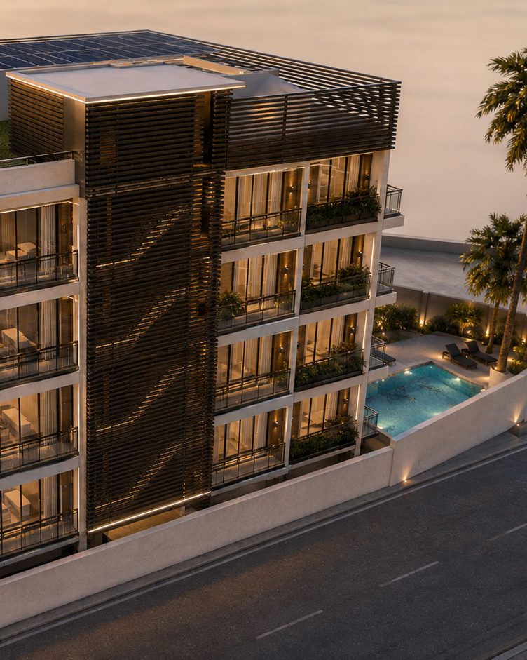 Casabella Tower from the air at sunset: the walled plot on its Palm Beach street, with the pool terrace and loungers alongside the building, palms on the boundary and the solar array on the roof.
